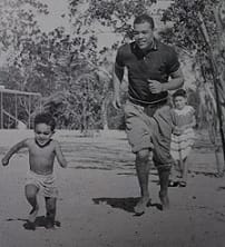 Barrow, Jr. plays with his father. Circa 1953.