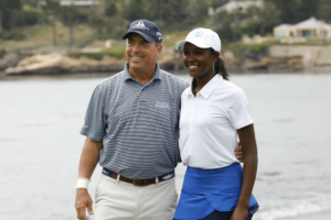 Shani Waite poses by the water with her pro golf partner at Pebble Beach