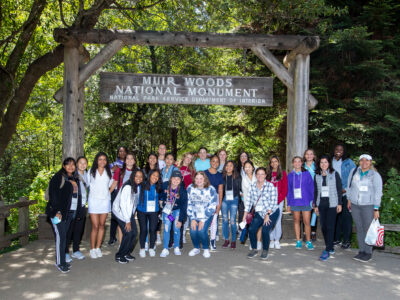 Group of participants posing at the Muir Woods National Monument.
