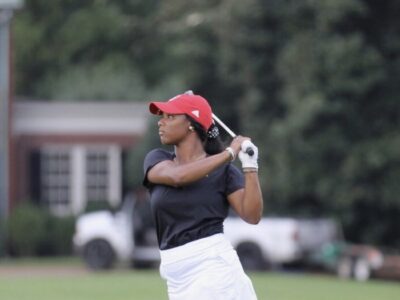 First Tee alumna Karrington Knight playing golf.