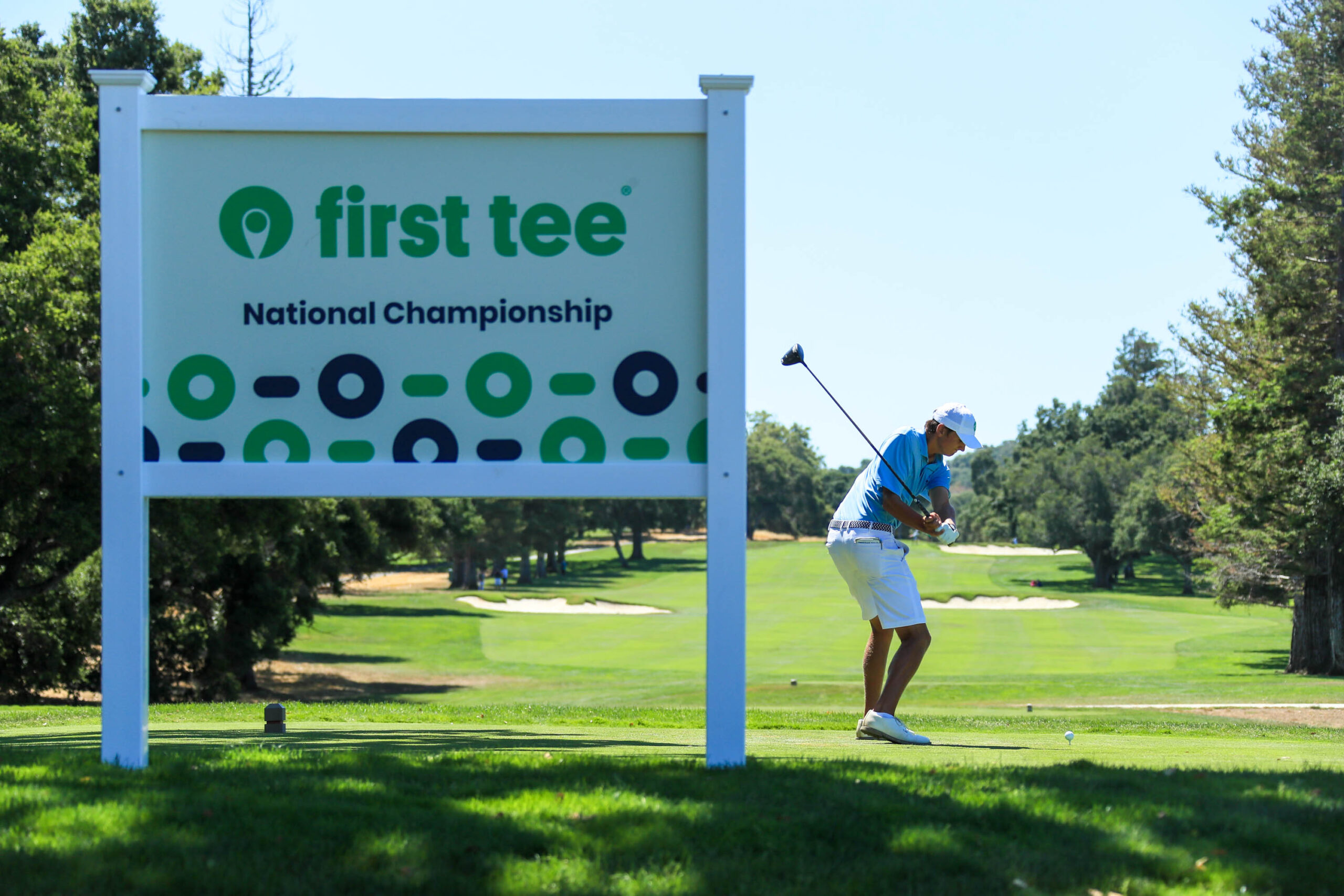 Boy hitting a tee shot at the 2023 National Championship.