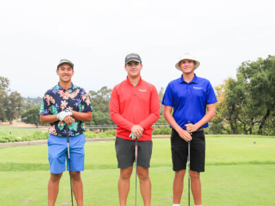 Group of three boys standing on a tee box at 2023 First Tee National Championship.