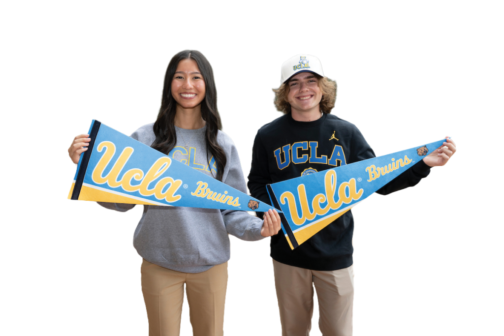 Scholars holding UCLA pennants