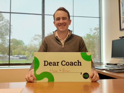 Holding Dear Coach sign