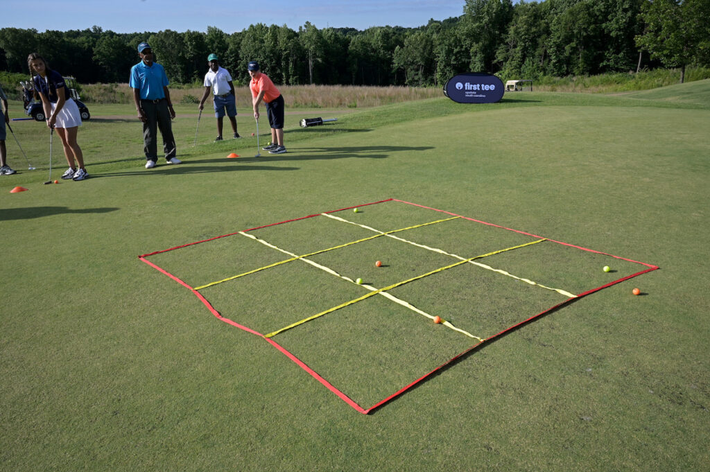 Kids play tic tac toe putting